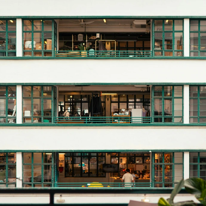 Modern office building with many green framed windows
